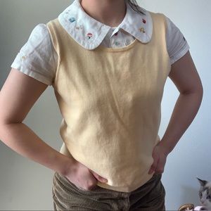 Yellow sweater vest